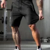 Men's solid color shorts, with zipper pockets, casual elastic drawstring shorts with a loose waist and high elasticity, suitable
